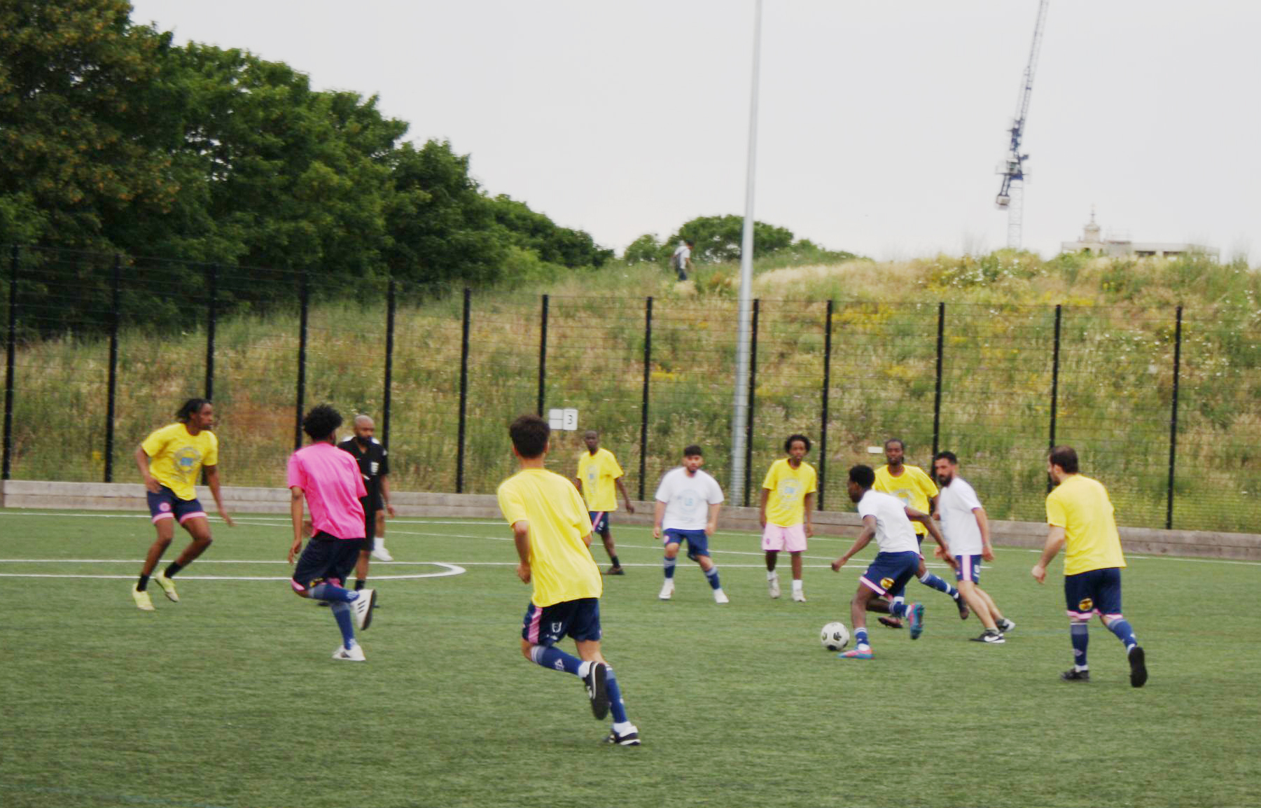 Players on the field during the Refugee Week football match